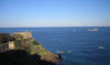 Punta Falcone vista da SE la cui sommit  dominata dalla villa, il giardino e il parco dove visse Napoleone. In lontananza l'isola "Lo Scoglietto". 